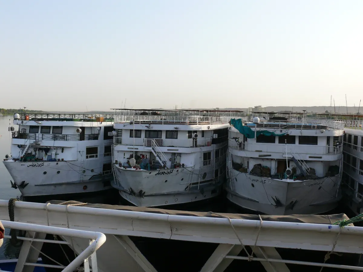 Several Nile cruise ships tied side by side at Aswan, ready for a Nile river cruise