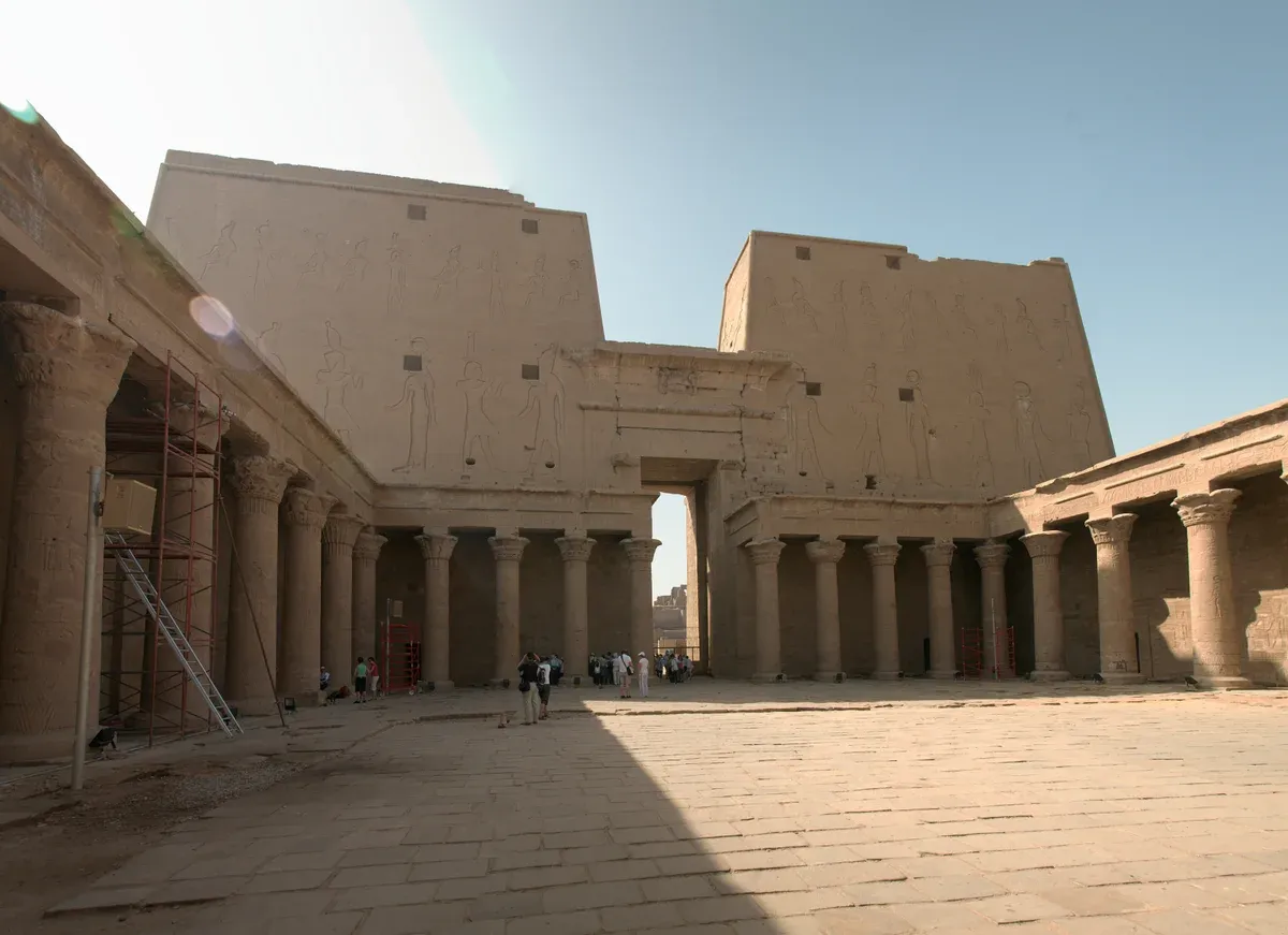 The pylon and colonnaded court of the Temple of Horus at Edfu on a Nile river cruise