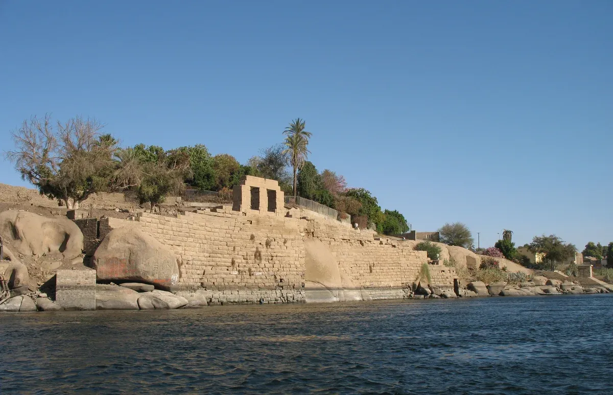 Ancient stone ruins on the bank of Elephantine Island at Aswan, reached by felucca on a Nile river cruise