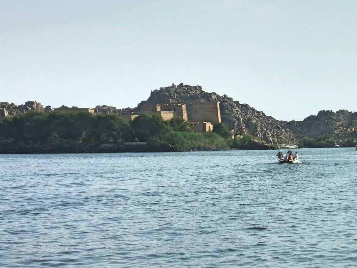 Philae temple on Agilkia Island seen from a boat on a Nile river cruise from Aswan