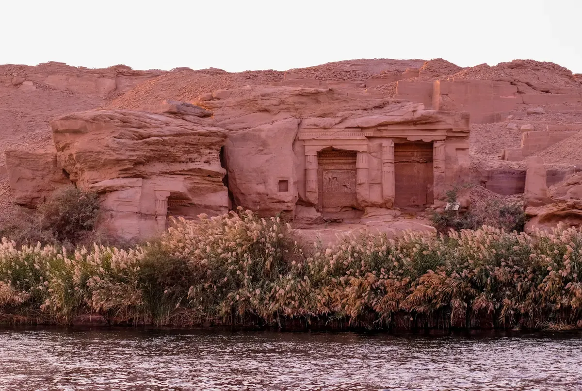 Rock-cut shrines on the Nile bank at Gebel el-Silsila, passed on a Nile cruise or dahabiya trip