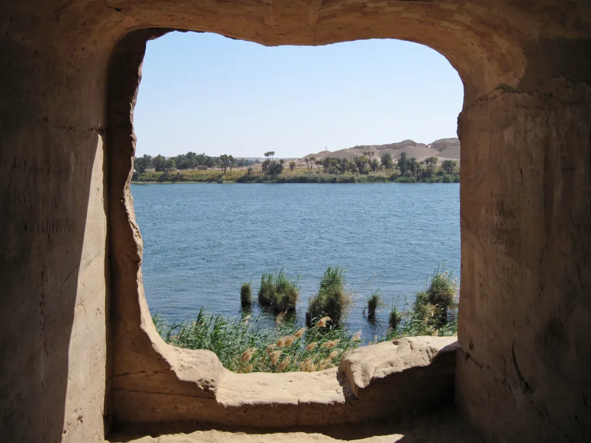 The Nile seen through a rock opening in the sandstone quarries of Gebel el-Silsila on a Nile cruise